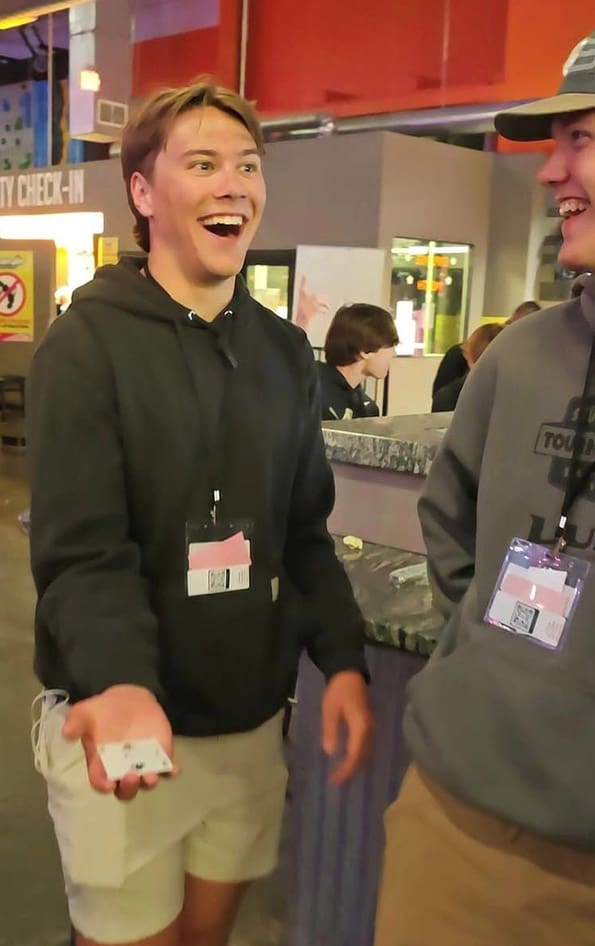 Student reacting with amazement to a magic trick